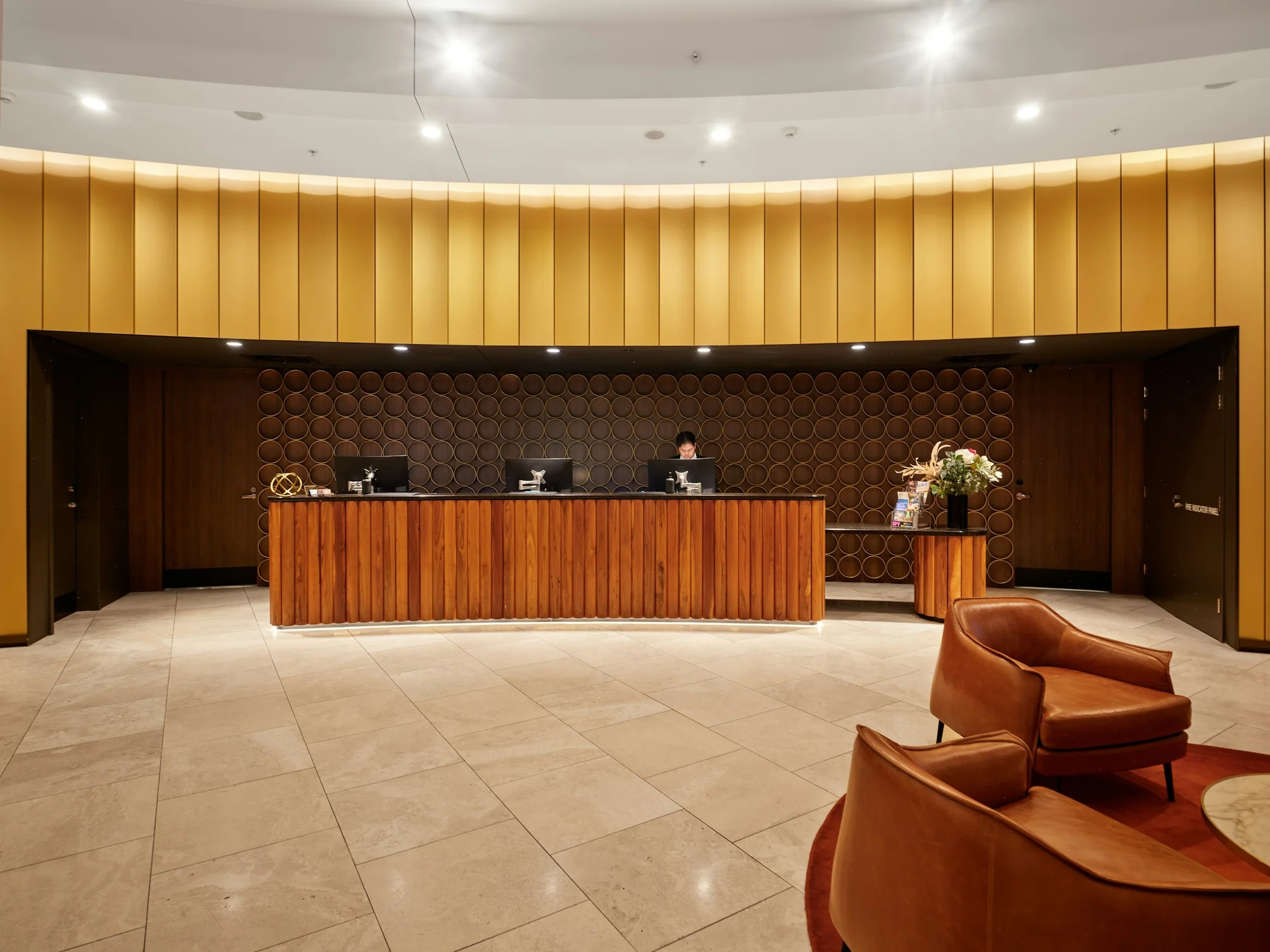 A hotel reception desk in a quiet lobby