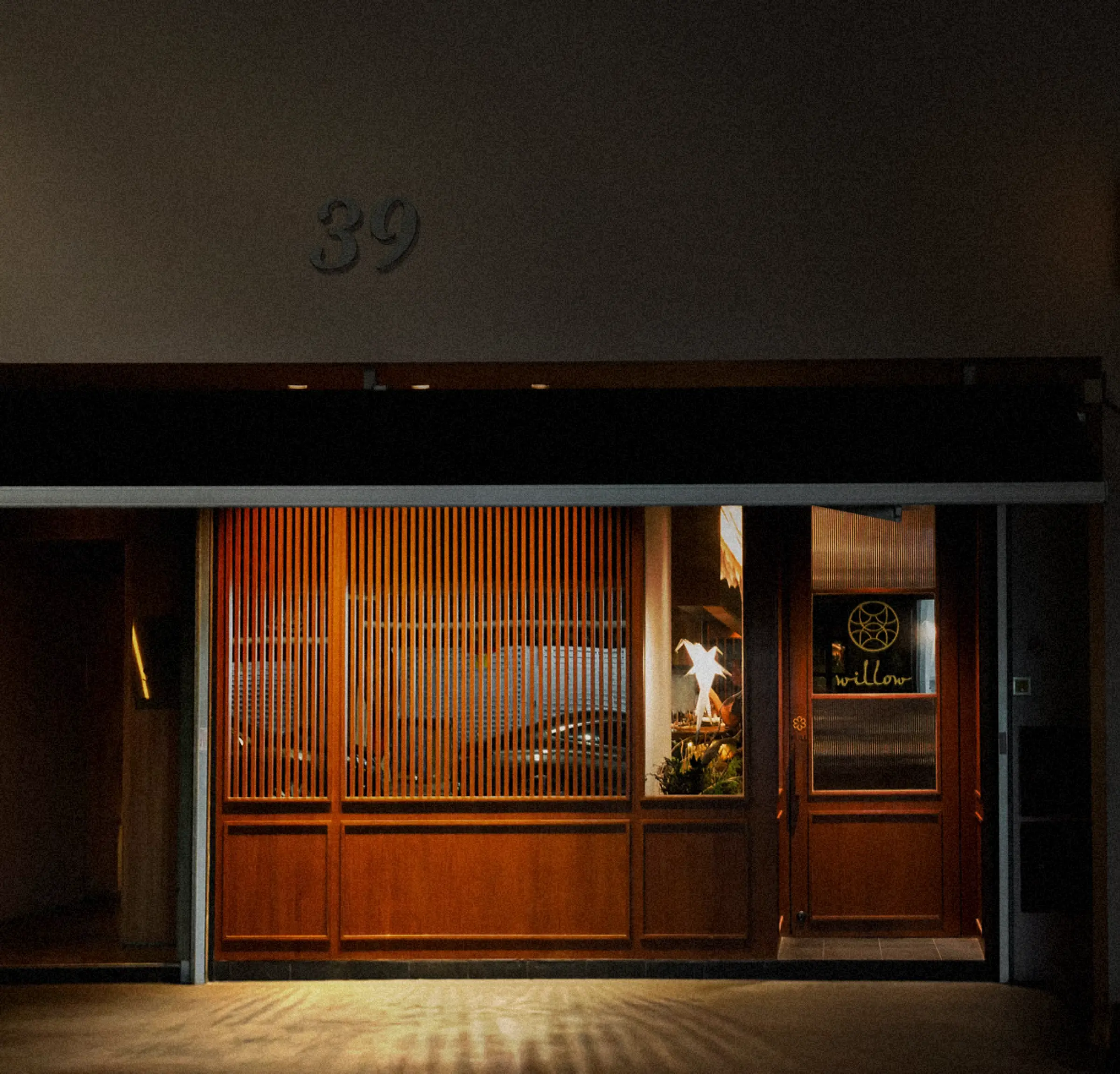 The Willow shopfront at night