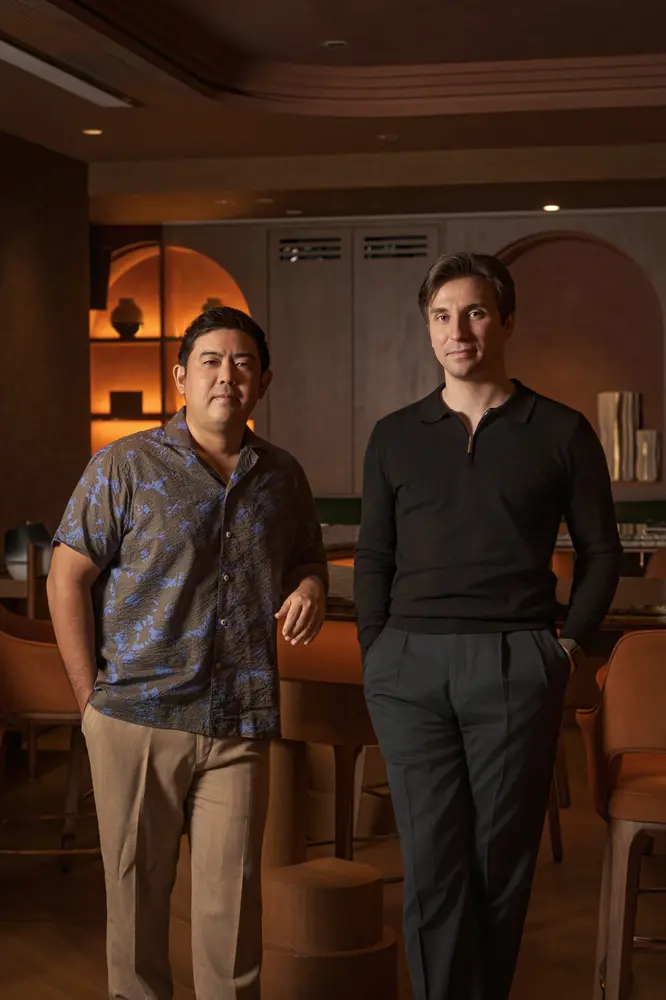 Lim Kian Chun (left) and Philipp Hölke (right) in a dining room