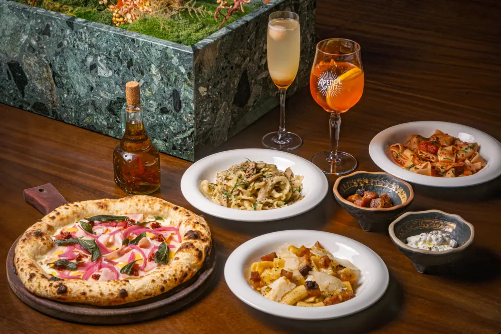 Casa Vostra, a table of pizza and pasta